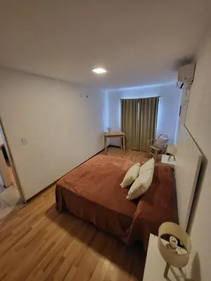 a bedroom with a large bed with pillows on it at Lamorit in Almafuerte