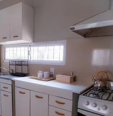 a kitchen with a stove and a white counter top at Lamorit in Almafuerte