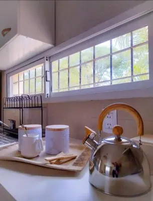 a kitchen counter with two cups and a tea kettle at Lamorit in Almafuerte