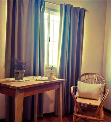 a table and a chair in front of a window at Lamorit in Almafuerte