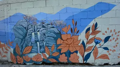 a mural on a wall with flowers on it at Moderno Departamento para parejas Merlo S Luis centro Vistas in Merlo