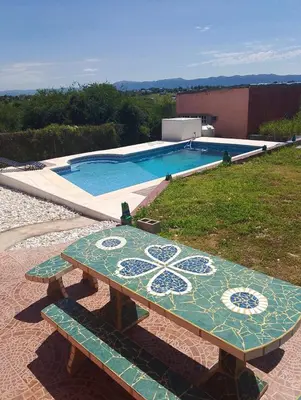 a pool with a table and a swimming pool at Lucerito no reserve x aca in Villa Santa Cruz del Lago