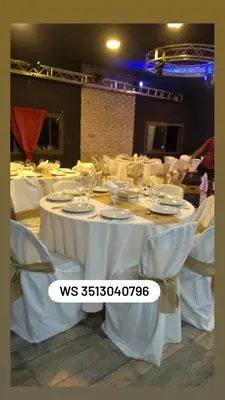 a group of tables and chairs with white table cloth at Lucerito no reserve x aca in Villa Santa Cruz del Lago