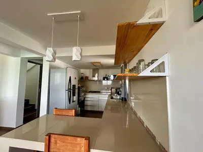 a large kitchen with a large glass counter top at Casita verde in Villa Santa Cruz del Lago