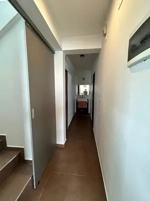 an empty hallway with a hallway leading to a room at Casita verde in Villa Santa Cruz del Lago