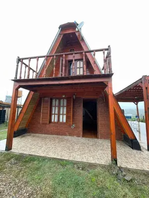 a house with a roof on top of it at Cerro del Alma in Villa Yacanto