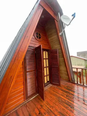 an open door on the deck of a house at Cerro del Alma in Villa Yacanto