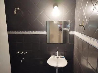 a bathroom with a sink and a mirror at DepartamentoVCP in Villa Carlos Paz