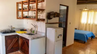a kitchen with a refrigerator and a sink at Cabaña para 2 Personas en Arroyo de los patos in Arroyo de Los Patos