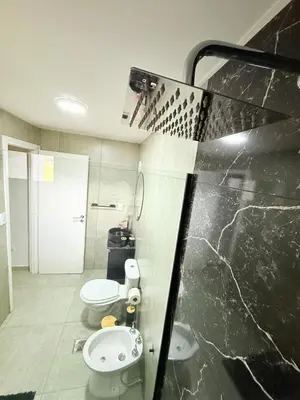 a bathroom with a toilet and a sink at MontSelah Casa en la montaña con pileta para 2 in Tanti