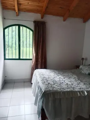 a bedroom with a bed and a window at Casa Los Hornillos in Los Hornillos