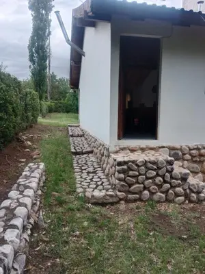 a building with a pile of rocks around it at Casa Los Hornillos in Los Hornillos