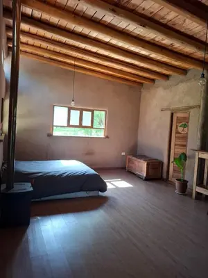 a bedroom with a large bed and a window at Espaz in Las Calles