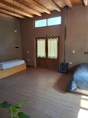 a large room with a bed and a window at Espaz in Las Calles