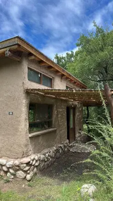a stone house with a window on the side of it at Espaz in Las Calles