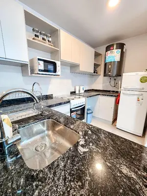 a kitchen with a sink and a counter top at Dpto Carlos Paz - 1 dormitorio con pileta in Villa Carlos Paz