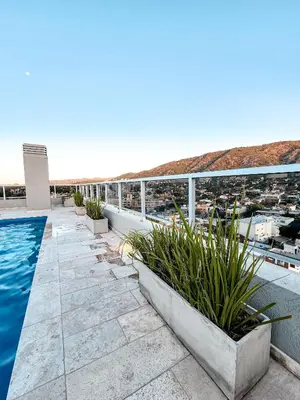 a view from the balcony of a building with a swimming pool at Dpto Carlos Paz - 1 dormitorio con pileta in Villa Carlos Paz