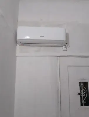 a white router sitting on top of a white door at Monoambiente Cerro de las Rosas in Cordoba