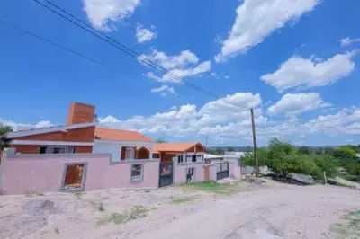 a house sitting on the side of a dirt road at Casa entera in Mina Clavero