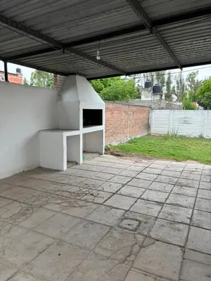 an outdoor patio with a white stove in a building at Alojamiento en Villa Cura Brochero in Villa Cura Brochero