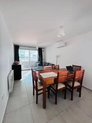 a dining room with a table and chairs at Depto con hermosas vistas, centro con solarium y seguridad in Cordoba