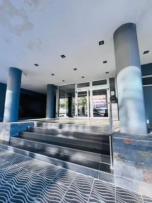 an empty lobby with stairs in a building at Depto con hermosas vistas, centro con solarium y seguridad in Cordoba
