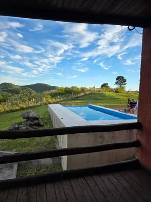 a view from a window of a swimming pool at Munay Ky in Villa Ciudad de America