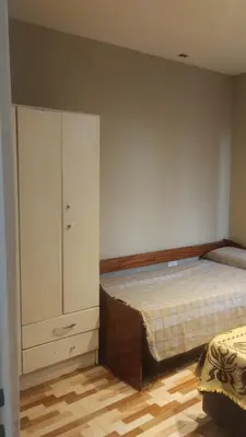 a bedroom with a bed and a dresser at Las Lomitas 2 in Villa Cura Brochero