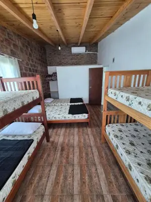 a room with three bunk beds in it at Cabaña La Zarzamora in La Estancia