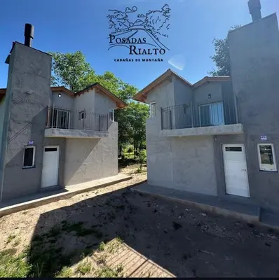 a view of a house with two buildings at cabañas RIALTO in Villa Amancay