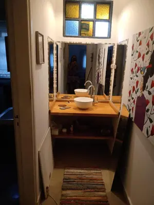 a bathroom with a sink and a mirror at Victoria in Villa Icho Cruz