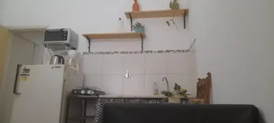 a kitchen with a refrigerator and a counter top at Victoria in Villa Icho Cruz