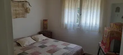 a bedroom with a bed and a window at Victoria in Villa Icho Cruz