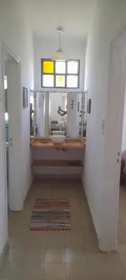 a bathroom with a sink and a window at Victoria in Villa Icho Cruz