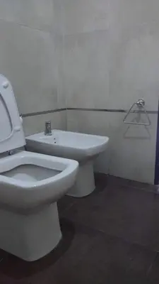 a bathroom with a white toilet and a sink at casa lomas in San Antonio de Arredondo