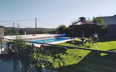 a swimming pool with a gazebo in a yard at casa lomas in San Antonio de Arredondo