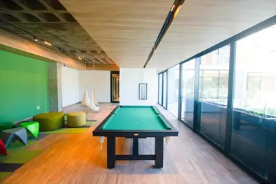 a room with a ping pong table in the middle at Departamento de lujo frente al quality espacio in Cordoba