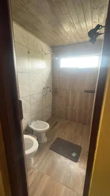 a small bathroom with a toilet and a bidet at Ecolodge in Potrero de Garay