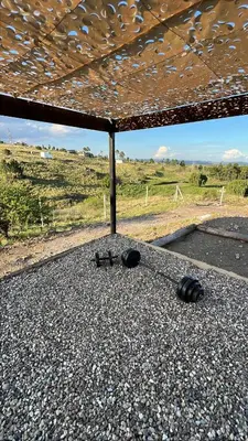 a group of objects sitting on the ground under a roof at Ecolodge in Potrero de Garay