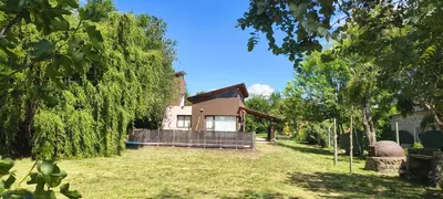 a house in the middle of a yard at Casa privada con piscina Potrero de Garay in Potrero de Garay
