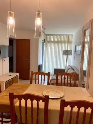a kitchen and dining room with a table and chairs at Dpto Gral paz Tranquilo y comodo in Cordoba