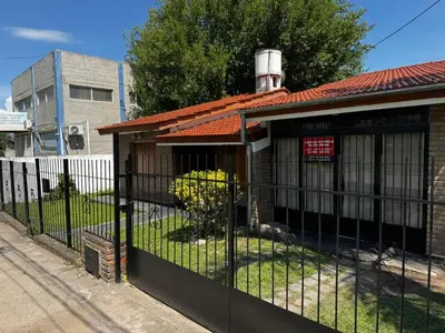 a fence in front of a house at Casa Simaldo in Villa Carlos Paz