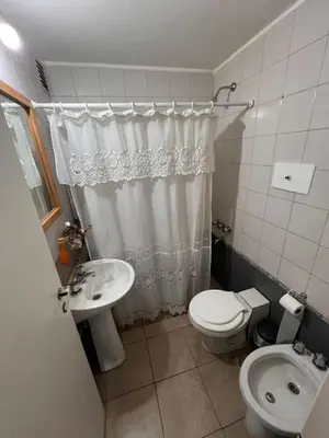 a small bathroom with a toilet and a sink at Departamento en Cordoba in Cordoba