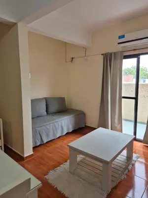 a living room with a couch and a coffee table at Temporario Carlos Paz in Villa Carlos Paz