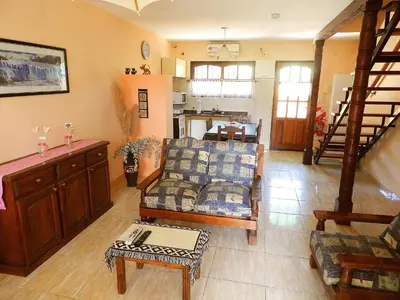 a living room with a couch and a table at ANELE, duplex equipado in Villa Carlos Paz