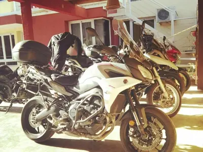 a row of motorcycles parked in front of a building at Lisandro in Villa Carlos Paz