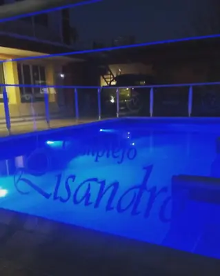 a view of a swimming pool at night at Lisandro in Villa Carlos Paz