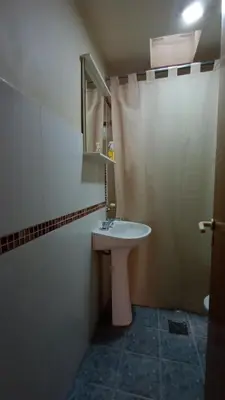 a bathroom with a sink and a mirror at Lisandro in Villa Carlos Paz