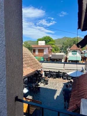 a view of a patio with tables and chairs at Posada Novalis in Villa General Belgrano