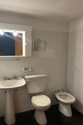 a bathroom with a toilet and a sink at Posada Novalis in Villa General Belgrano